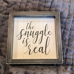 Sign that say “The snuggle is real”